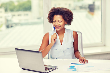 Image showing happy african woman with laptop at office