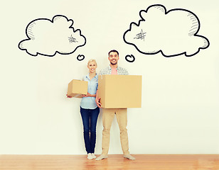 Image showing couple with cardboard boxes moving to new home