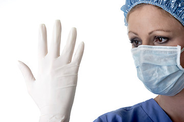 Image showing Lady surgeon checking gloves