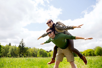 Image showing happy couple with backpacks having fun outdoors