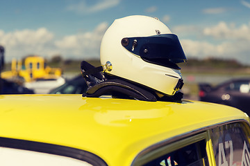 Image showing close up of car with helmet on roof top