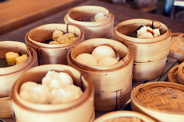 Image showing meat or rice balls in wooden containers