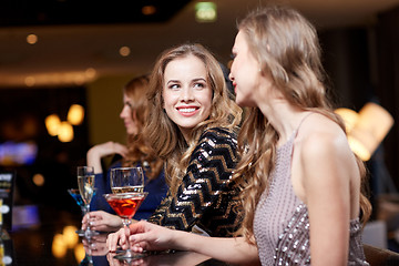 Image showing happy women with drinks at night club