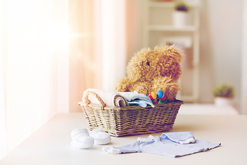 Image showing close up of baby clothes and toys for newborn