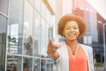 Image showing happy young african american businesswoman in city