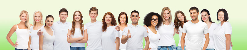 Image showing group of happy different people in white t-shirts