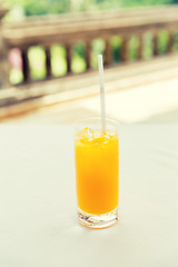 Image showing glass of fresh orange fruit juice at restaurant