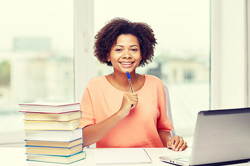 Image showing happy african american woman with laptop at home