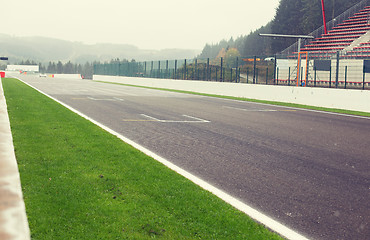 Image showing close up of speedway track or road and stands