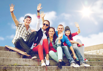 Image showing group of smiling teenagers hanging out