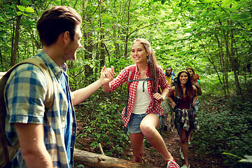 Image showing group of smiling friends with backpacks hiking