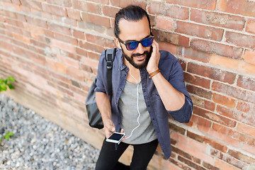 Image showing happy man with earphones listening to music