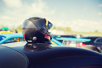 Image showing close up of car with helmet on roof top