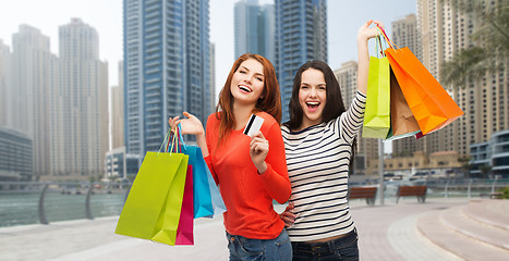 Image showing teenage girls with shopping bags and credit card