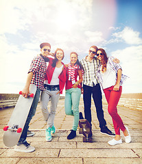 Image showing teenagers with skates outside