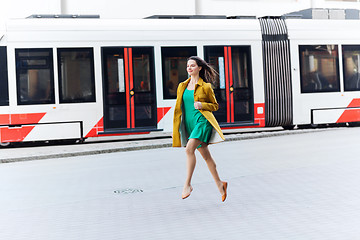 Image showing happy young woman or teenage girl on city street