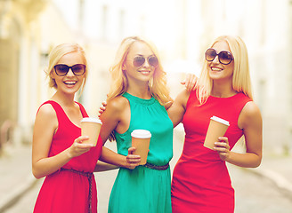 Image showing women with takeaway coffee cups in the city