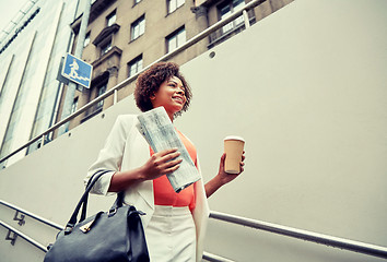 Image showing happy african businesswoman with coffee in city