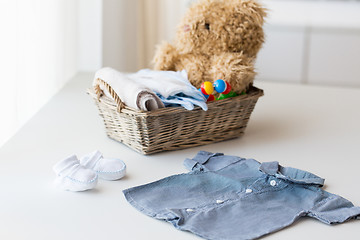 Image showing close up of baby clothes and toys for newborn