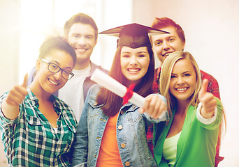 Image showing student girl in graduation cap with diploma