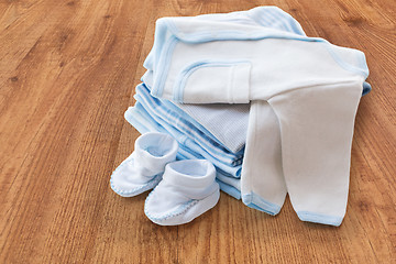 Image showing close up of baby boys clothes for newborn on table