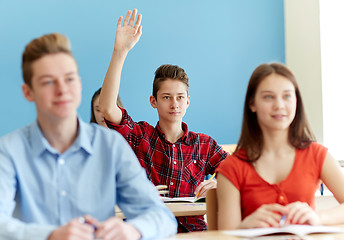 Image showing group of students with notebooks at school lesson