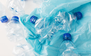 Image showing close up of used plastic bottles and rubbish bag