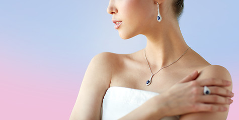 Image showing beautiful woman with earring, ring and pendant