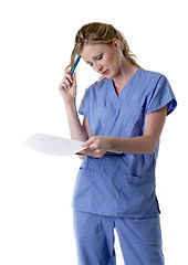 Image showing Nurse studying patient chart