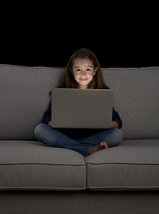 Image showing Little girl working with a laptop