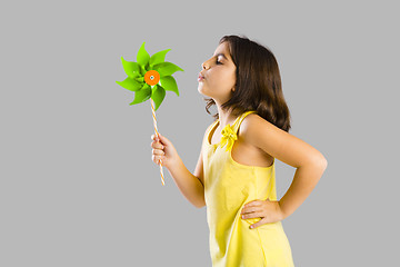 Image showing Girl blowing a windmill