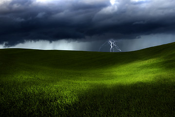 Image showing Green land over a storm