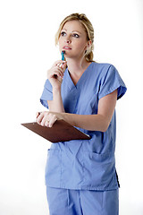 Image showing Nurse with clipboard thinking