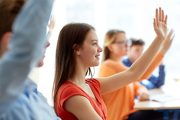 Image showing group of students with notebooks at school lesson