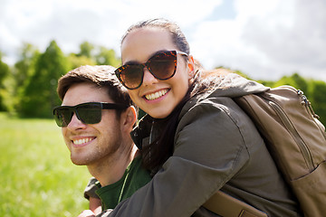 Image showing happy couple with backpacks having fun outdoors