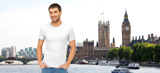 Image showing happy man in blank white t-shirt over london city