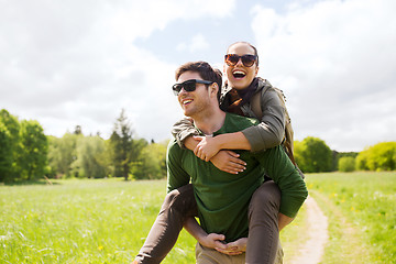 Image showing happy couple with backpacks having fun outdoors