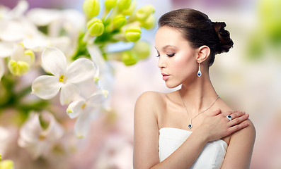 Image showing beautiful woman with earring, ring and pendant