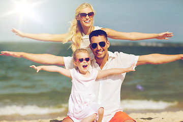 Image showing happy family having fun on summer beach