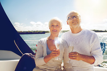 Image showing senior couple with glasses on sail boat or yacht