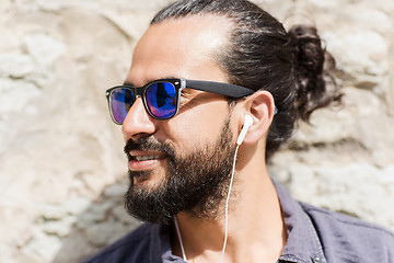 Image showing happy man with earphones listening to music