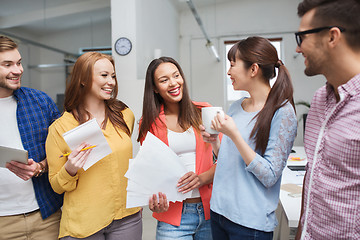 Image showing creative team on coffee break talking at office