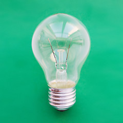 Image showing close up of bulb or incandescent lamp on green