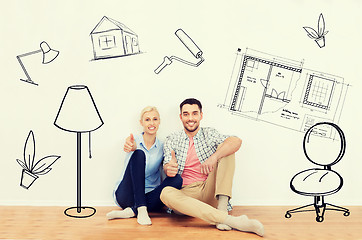 Image showing happy couple showing thumbs up at new home