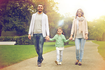 Image showing happy family walking in summer park