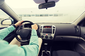 Image showing close up of young man driving car