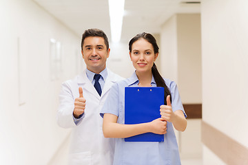 Image showing doctor and nurse showing thumbs up at hospital