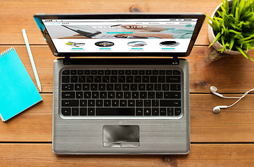 Image showing close up of laptop computer with online shop page