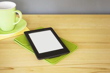 Image showing ebook reader on a wooden table