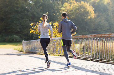 Image showing couple running or jogging outdoors